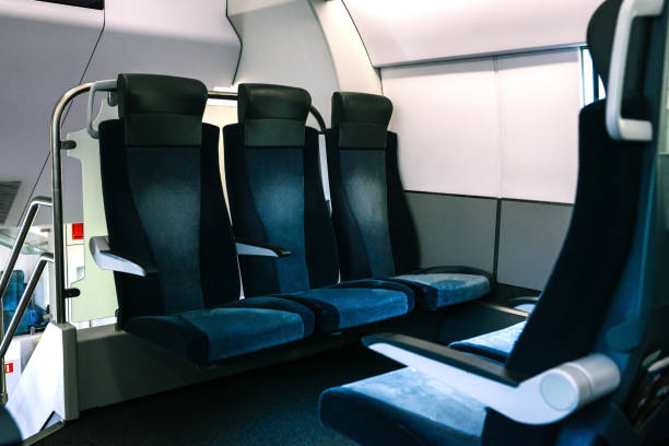 istock The train seats are blue. Empty seats in a modern and comfortable train. Convenient passenger transport for travel and business trips. Transportation, logistics and traffic concept 1281061472
