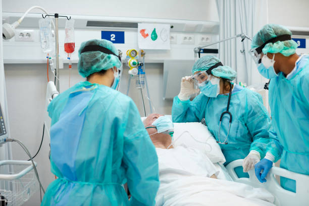 istock Female Doctor Talking With Patient Along Coworker 1281063043