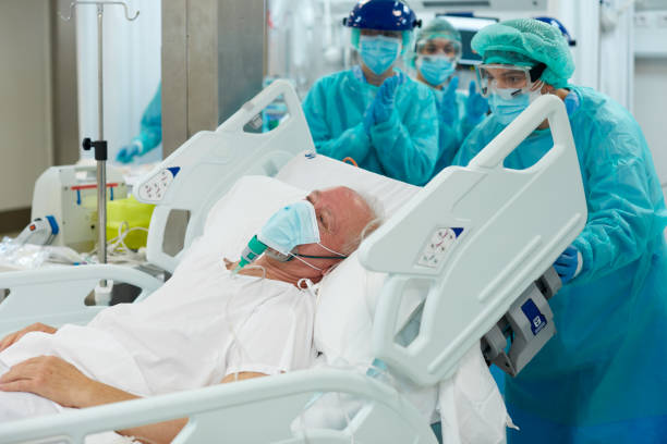 istock Doctors Pushing Patient on Gurney in Corridor 1281063063