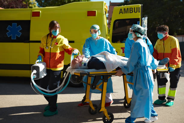 istock Ambulance and Hospital Workers Moving Patient on Stretcher 1281063081