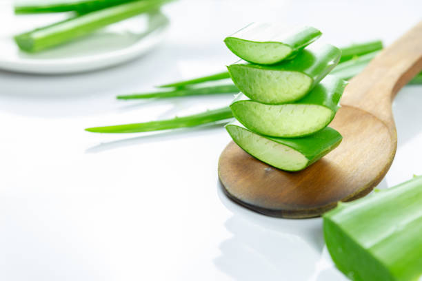 istock Aloe Vera sliced on wood spoon isolated on white background. 1281063471