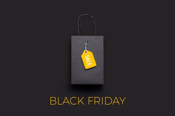 istock Black paper shopping bag on black background 1281067360