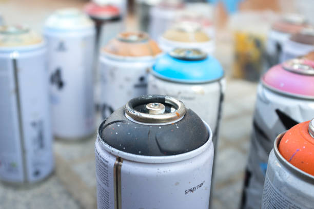 istock Used paint aerosol cans without valves. Selective focus 1281069224