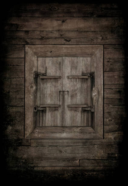 istock Old boarded up window with wooden shutters 1281069990