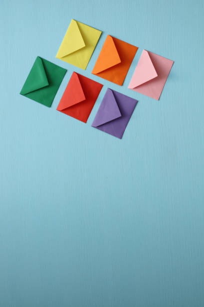 istock Close-up of color envelopes on blue background 1281073575