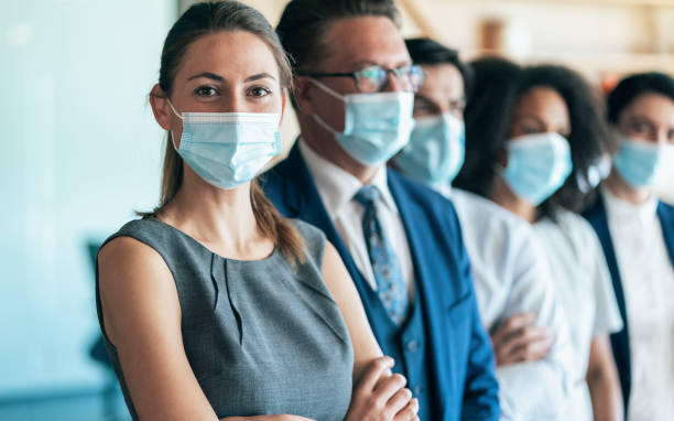 istock Business team with face protective mask 1281074127