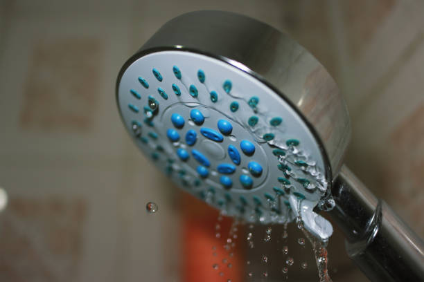 Shower Head And Falling Water Droplets Close-up Shower Head And Falling Water Droplets Close-up slow motion stock pictures, royalty-free photos & images