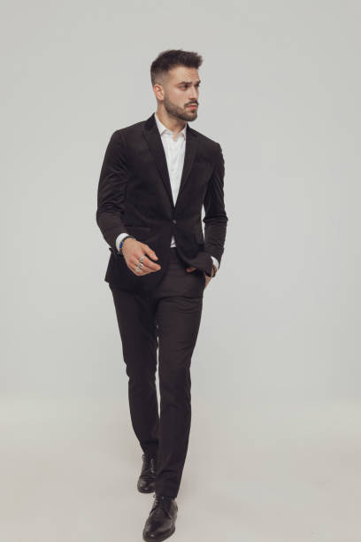 istock Confident fashion model curiously looking away with hand in pocket 1281075220