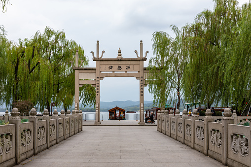 Hangzhou, China - October 15, 2020: Gongde or Merits & Virtues Archway facing West Lake in front of King Qian Temple, in memorial of Qian Liu who established Wu Yue Kingdom in 10th century.