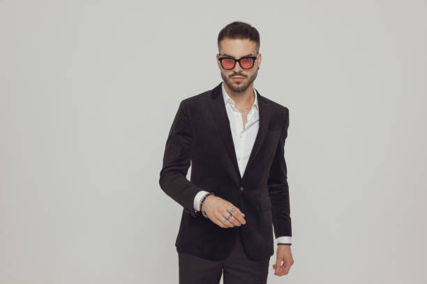 istock Confident fashion model wearing sunglasses while walking 1281076088