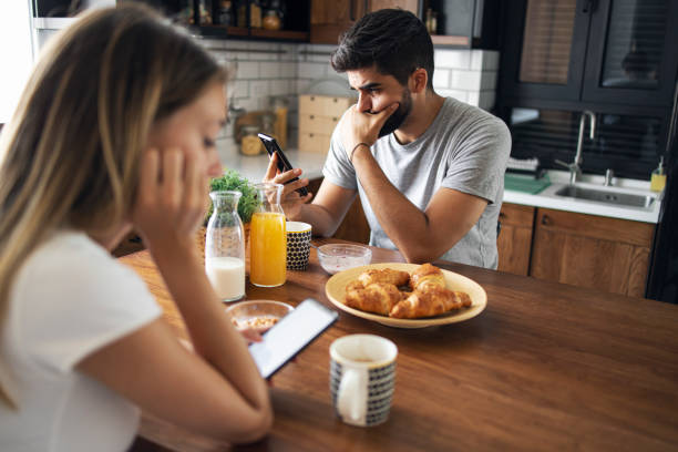 istock Unhappy couple sitting in the kitchen 1281076273