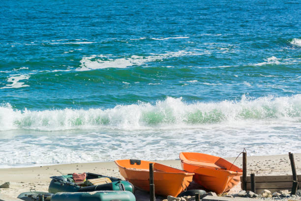 istock Several boats stand on the sandy shore by the sea 1281076771