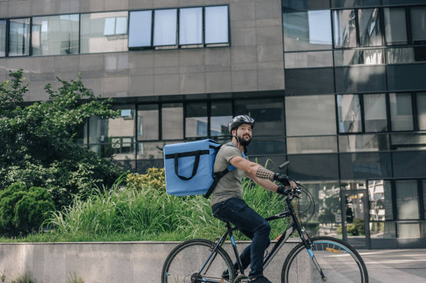 istock Courier delivering food to customer at downtown district 1281077420