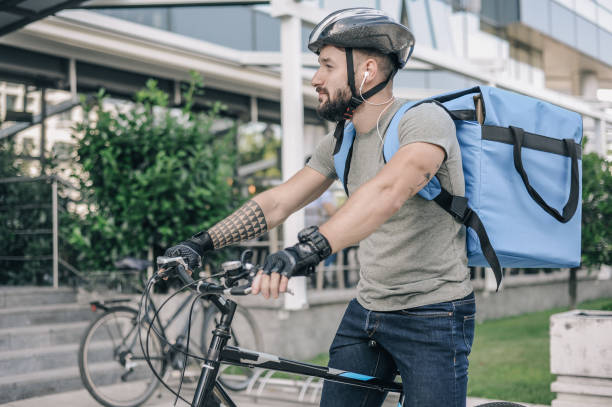 istock Courier delivering food to customer at downtown district 1281077437