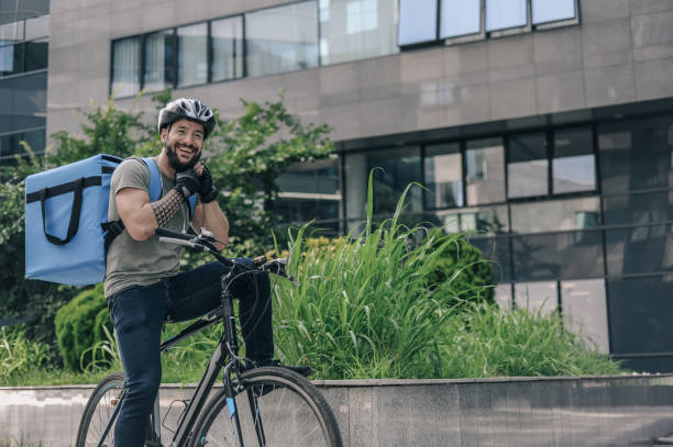 istock Courier delivering food to customer at downtown district 1281077442