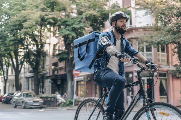 istock Courier delivering food to customer at downtown district 1281077474