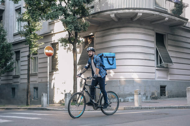 istock Courier delivering food to customer at downtown district 1281077498