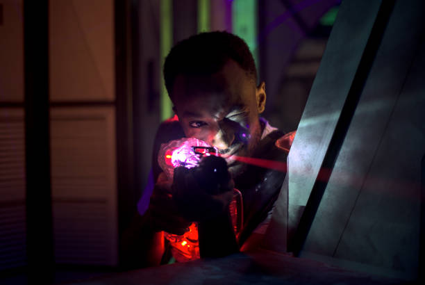 istock laser gun player shooting in futuristic labyrinth 1281078727