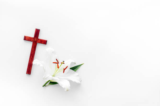 istock Lily funeral flower with cross. Condolence card with copy space 1281079914