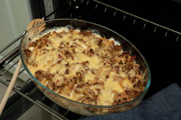 istock cooking Italian lasagna, preparing dressing for lasagna with ground beef and vegetables, Italian cuisine. 1281082855