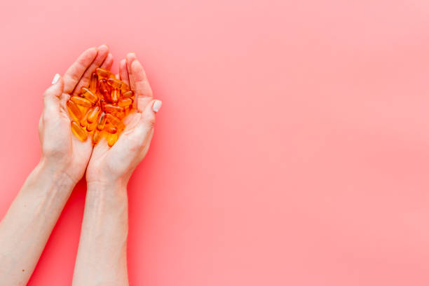 istock Omega fish cod liver oil capsules in hands, copy space 1281084080
