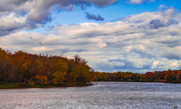 istock Autumn Landscape - Lake with Red Trees and Cloudy Sky 1281084994