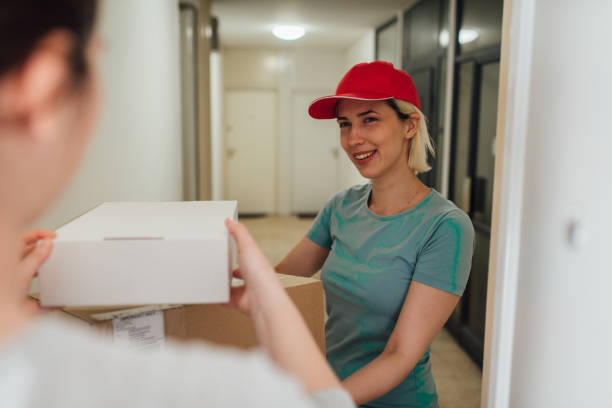 istock Girl delivering an order to her customer 1281085048