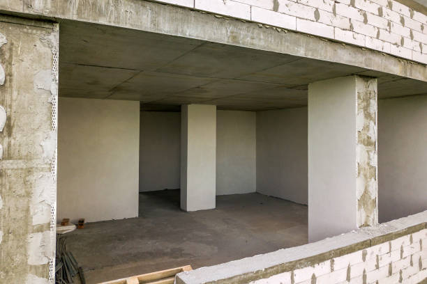 istock Rooms interior of new apartment building facade under construction. 1281086090