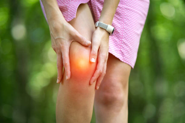istock Woman holding her knee with hands having strong pain. 1281086096