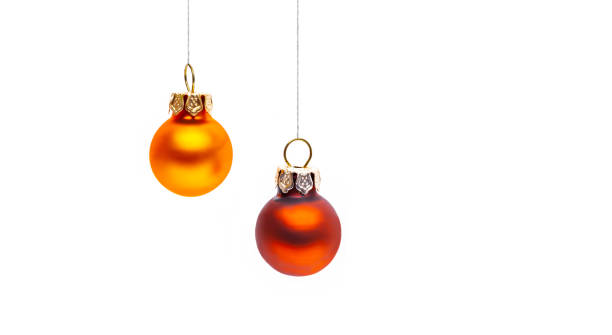 istock Two golden hanging Christmas balls 1281089115