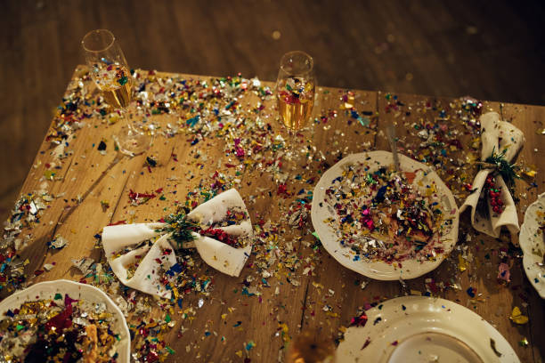 istock Scattered confetti over dining table after Christmas party. 1281090357