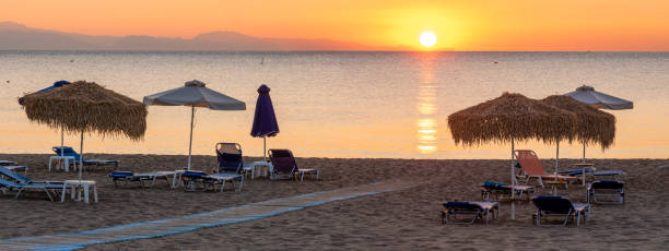 istock Beautiful sunrise over a sandy beach in Rhodes 1281091821