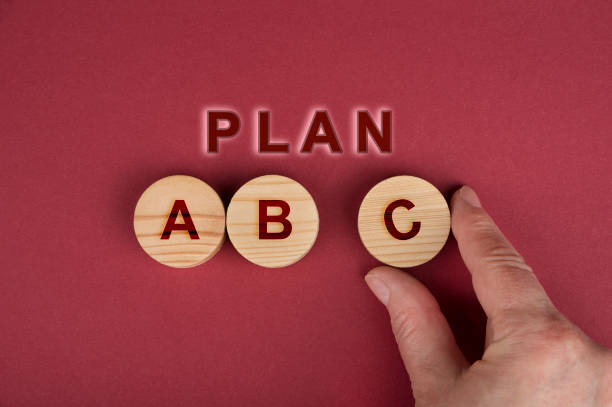 istock Plan A B C  sign on a wooden circles on a red 1281092126