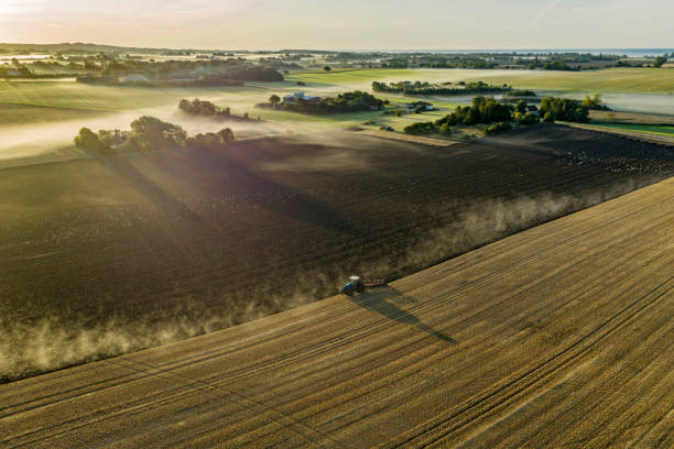 Farmer plowing a field. stock photo