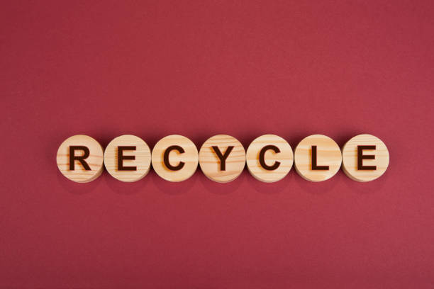 istock Recycle sign on a wooden circles on a red 1281094064