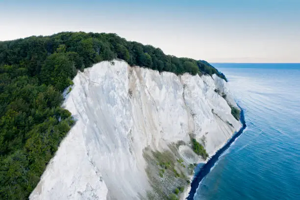 Drone’s eye view looking at cliffs at Moens Klint. Photographed in th early autumn on the island of Moen in Denmark. Colour, horizontal format with some copy space.