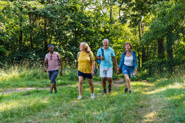 istock Seniors Walking in the Forest 1281095493