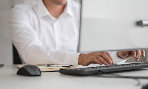 istock Businessman's Hands typing on keyboard Desktop computer, Business close-up detail 1281097057