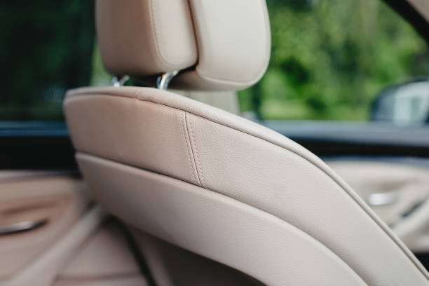 istock white leather car seats close up. 1281098961