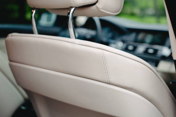 istock white leather car seats close up. 1281098966