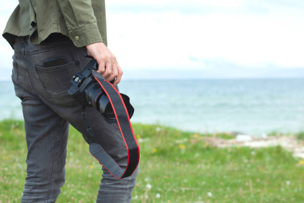 istock man is photographing the sea 1281100025