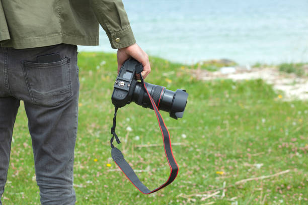 istock man is photographing the sea 1281100034