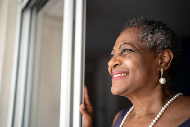istock Thoughtful senior woman looking at view 1281100047