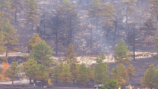 BOULDER, CO, USA - OCTOBER 18, 2020: Destroyed homes and property in the suburbs of Boulder, Colorado are burned to the ground the morning after the Cal Wood wildfire, the largest in Boulder County history, began in Jamestown, Colorado.