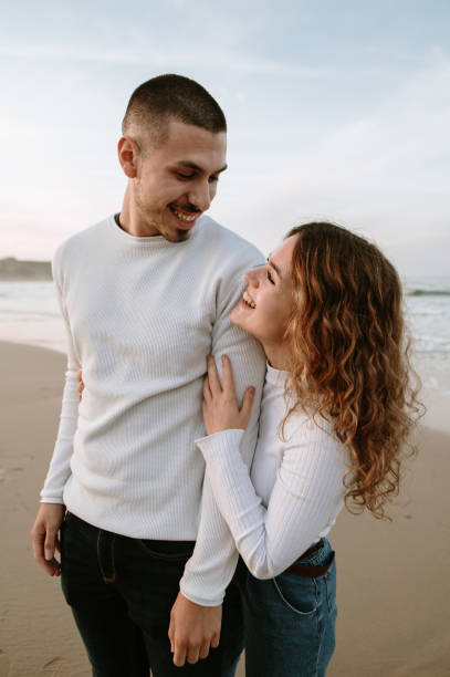 istock Young couple in love at a beach 1281103782