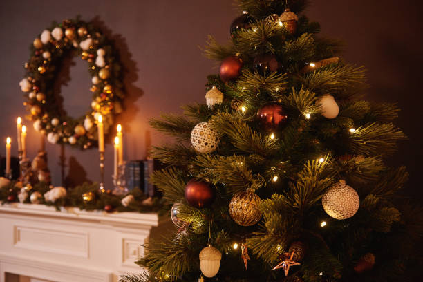 istock Bright christmas toy hanging on a green tree 1281104141