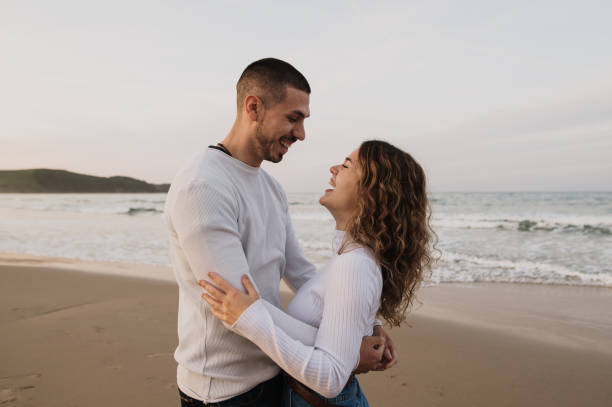 istock Young couple in love at a beach 1281104774