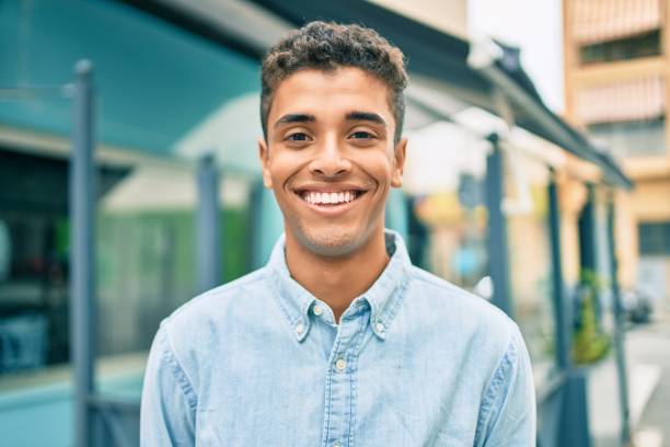 istock Young latin man smiling happy walking at the city. 1281105247