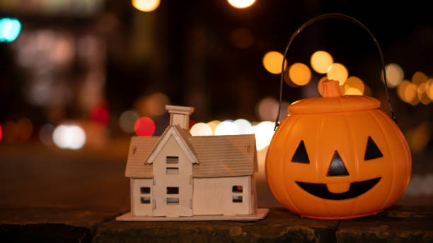 istock Pumpkins and floor-standing house designs for Halloween decorations. 1281105613
