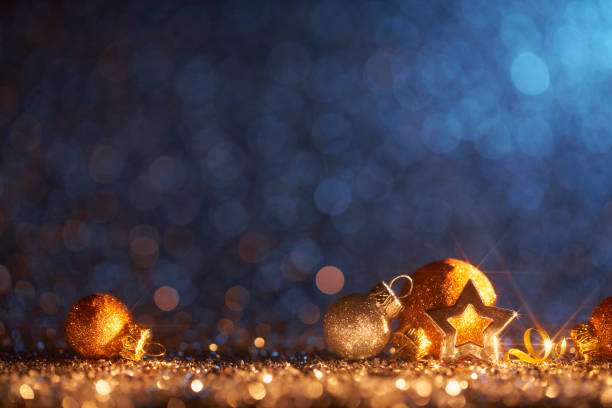 Sparkling Golden Christmas Ornaments - Decoration Defocused Bokeh Background Decorative Christmas still life photography. advent photos stock pictures, royalty-free photos & images